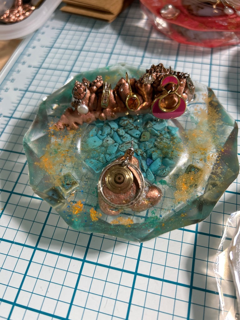 Copper Coral Treasure & Turquoise Ocean Resin Paperweight with eco earrings hanging on copper rock cluster