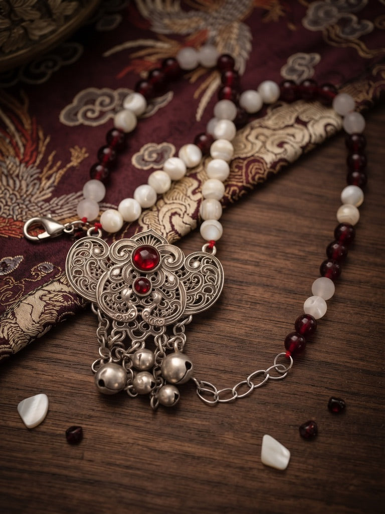 Garnet and Pearl Harmony 21 inch necklace with garnet agate beads and silver Miao filigree bell tassel pendant on dragon silk