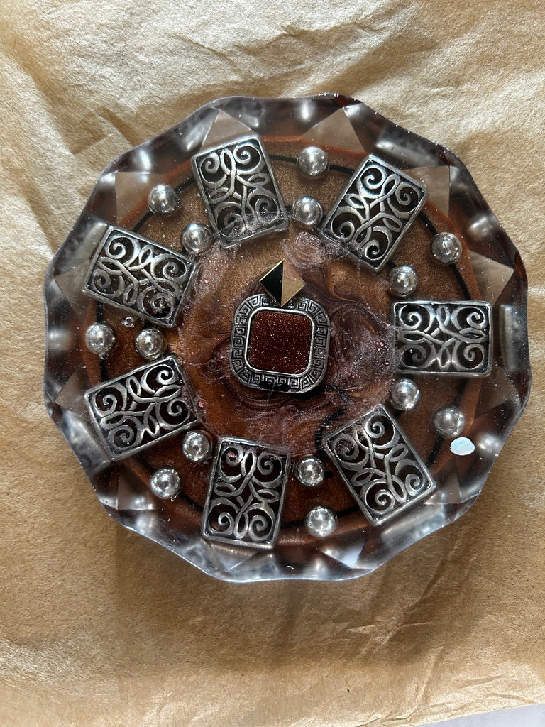 Silver Scroll Mandala, Goldstone & Pearl Circle Resin Paperweight – Miniature World with eight silver filigree scroll tiles and goldstone center in amber resin
