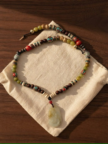 Jade Wanderer 22 inch beaded necklace with carved nephrite jade pendant
