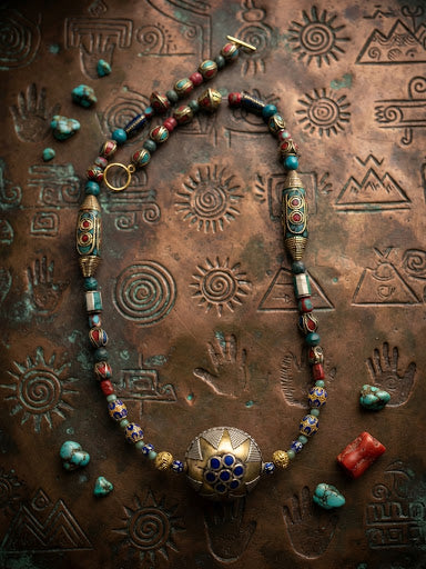 Tibetan mandala pendant necklace with cloisonné barrel beads, turquoise and garnet on etched copper background