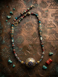 Tibetan mandala pendant necklace with cloisonné barrel beads, turquoise and garnet on etched copper background
