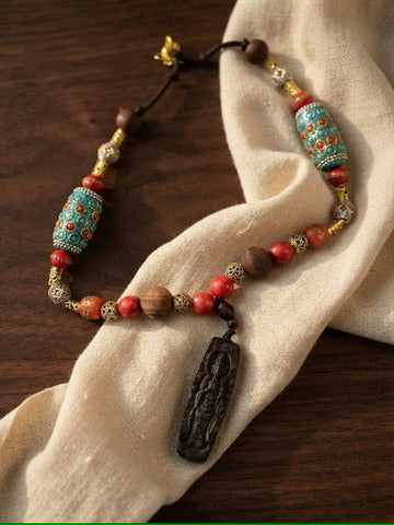 Obsidian Sutra 18 inch Tibetan necklace with carved obsidian Buddha pendant