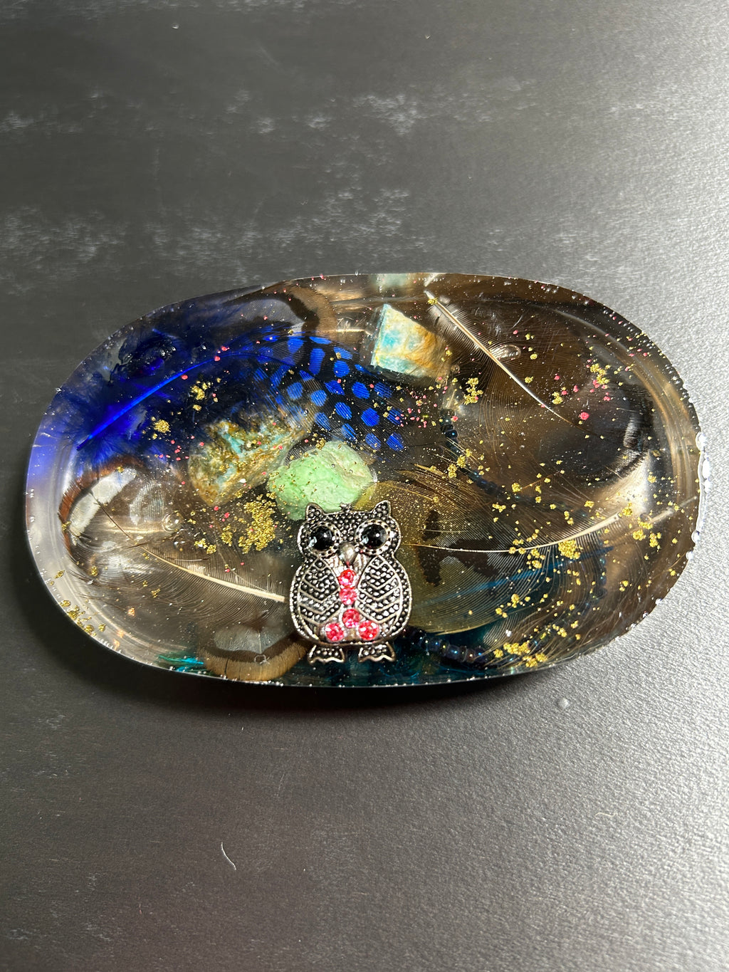 Midnight Owl, Peacock Feather & Malachite Oval Resin Paperweight – Miniature World with rhinestone owl and iridescent peacock feather in midnight black resin