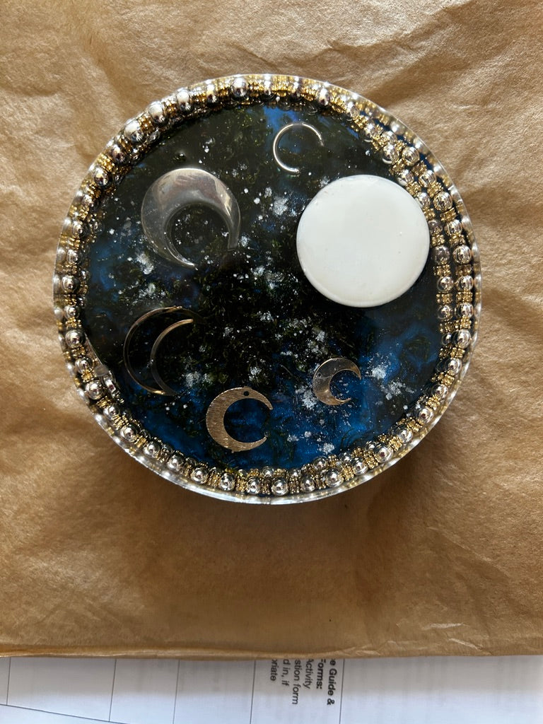 Lunar Calendar, Crystal Orb & Selenite Moon Circle Resin Paperweight – Miniature World with four silver crescent moon phases, crystal orb and white selenite disc in midnight galaxy resin