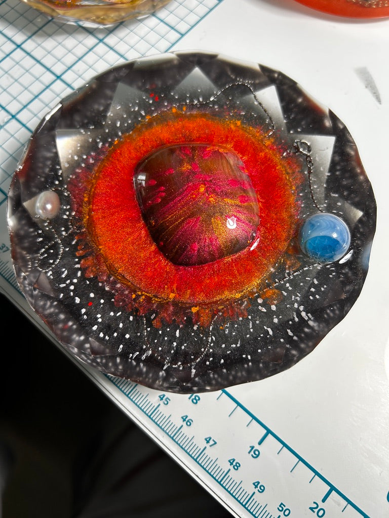 Sun, Earth & Moon Resin Paperweight – Miniature World showing garnet sun core, blue Earth and pearl Moon in star field