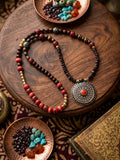 Earth and Ember necklace on wooden surface