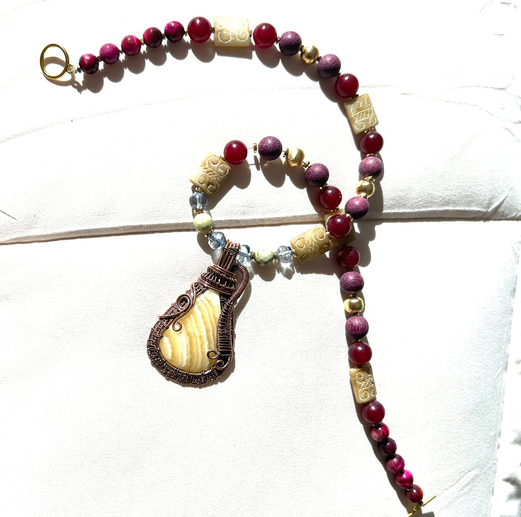 No. 49 Crimson Earth & Copper necklace flatlay close-up