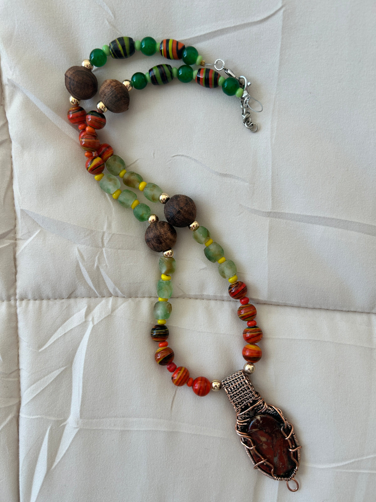 No. 51 African Earth & Silver necklace on white silk sunlit