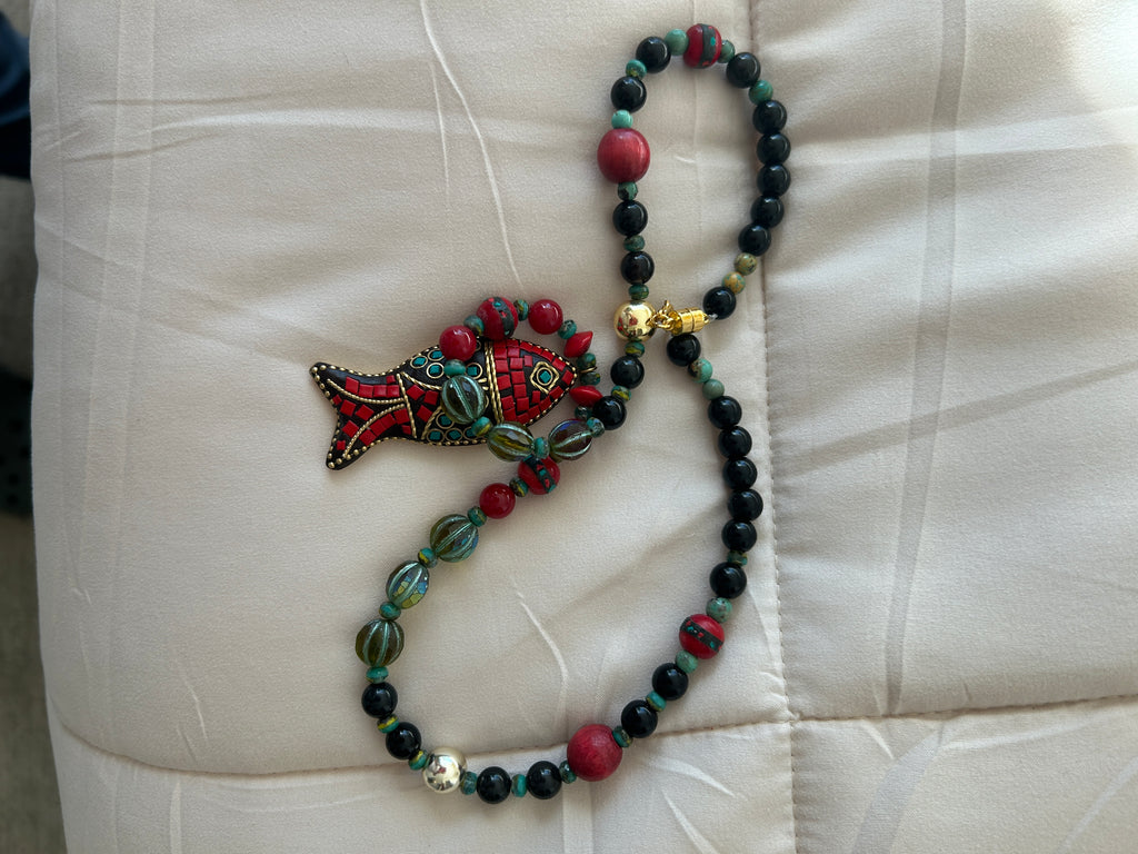 No. 57 Crimson Koi & Onyx necklace full view on wood