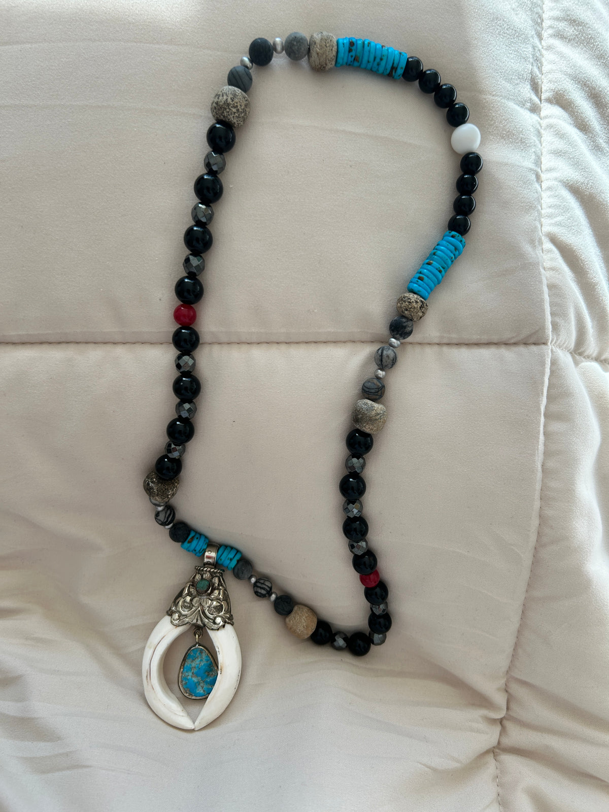 No. 60 Ivory Horn & Turquoise Sky necklace full view on wood