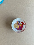 Pale resin paperweight with American and Chinese flag details, a gold-colored portrait medallion and red-purple accents