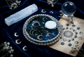 Lunar Calendar Crystal Orb & Selenite Moon Circle Resin Paperweight in midnight celestial moonlight editorial scene