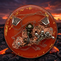 Volcanic Fire resin paperweight on volcanic landscape at twilight background with glowing orange lava flows through ancient black basalt rock and ember-lit sky with deep purples and fiery oranges