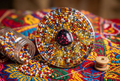 Thousand Beads Concentric Ring Circle Resin Paperweight in colorful textile bead craft festival editorial scene