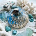 Chandelier Cove & Blue Tide Resin Paperweight in white sand and coastal scene