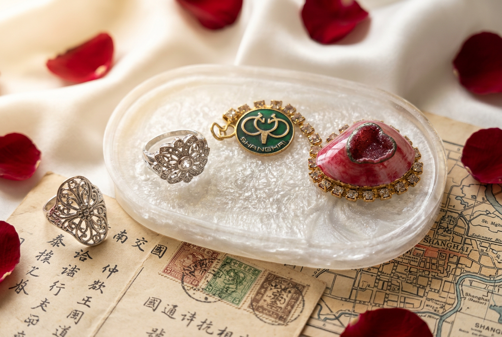 Shanghai Medallion Heart & Silver Ring Oval Resin Paperweight in romantic cross-world love story editorial scene